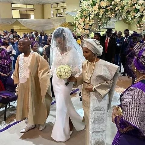 Bishop David Oyedepo and Faith Oyedepo Walking their daughter down the aisle.